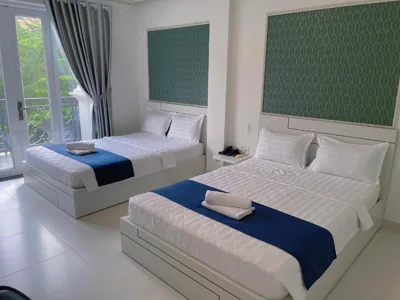 Habitación doble con dos camas dobles — Vi An Hotel